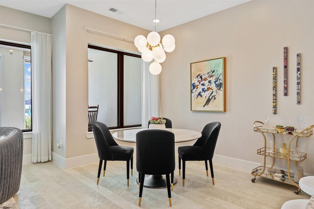 dining area featuring an inviting chandelier