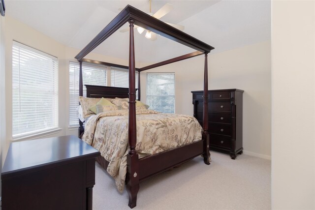 carpeted bedroom featuring ceiling fan and baseboards