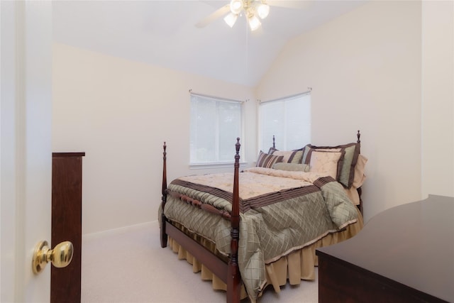 carpeted bedroom featuring a ceiling fan, baseboards, and vaulted ceiling