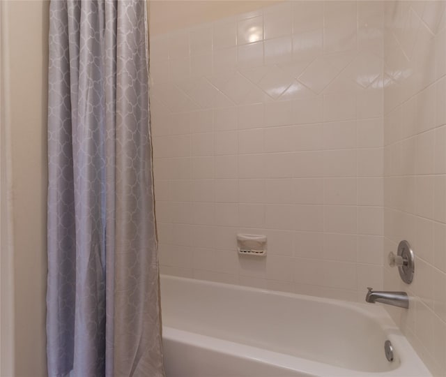 full bathroom featuring shower / bath combo with shower curtain