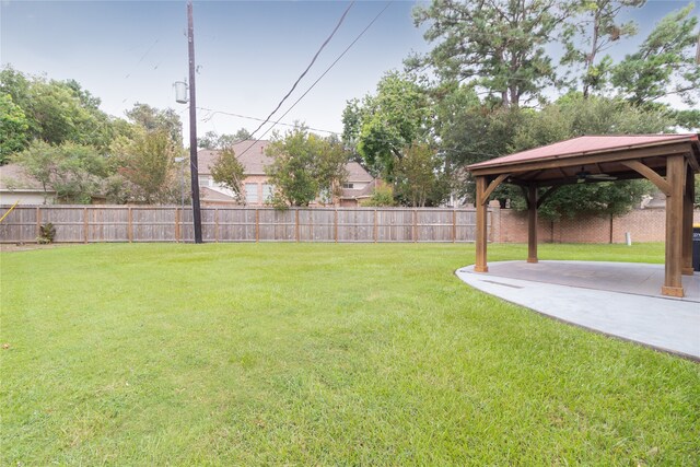 view of yard featuring a patio area and a gazebo