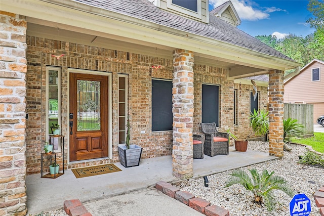 doorway to property with covered porch