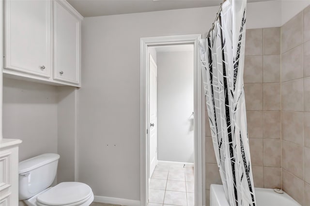 full bathroom featuring tile patterned floors, shower / tub combo with curtain, vanity, and toilet