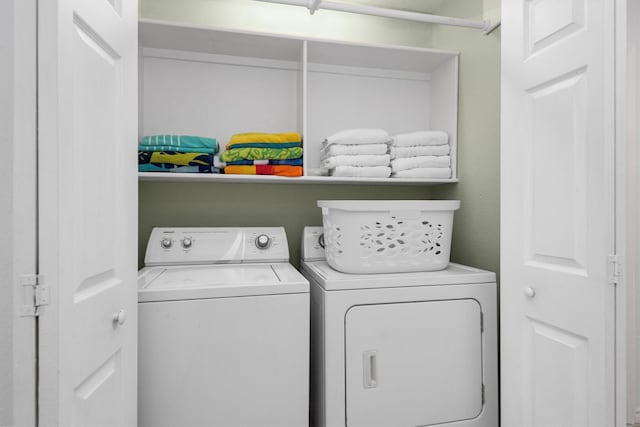 laundry area featuring washer and dryer and laundry area