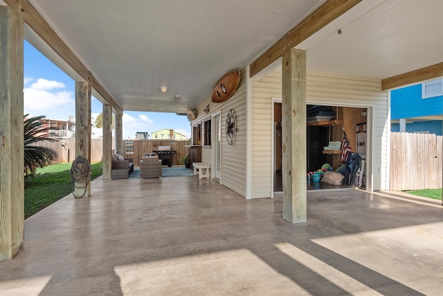 view of patio featuring fence