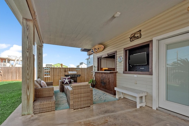 view of patio / terrace with outdoor lounge area and fence