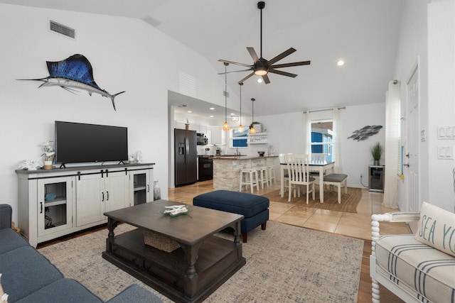 living area featuring ceiling fan, high vaulted ceiling, light tile patterned flooring, recessed lighting, and visible vents