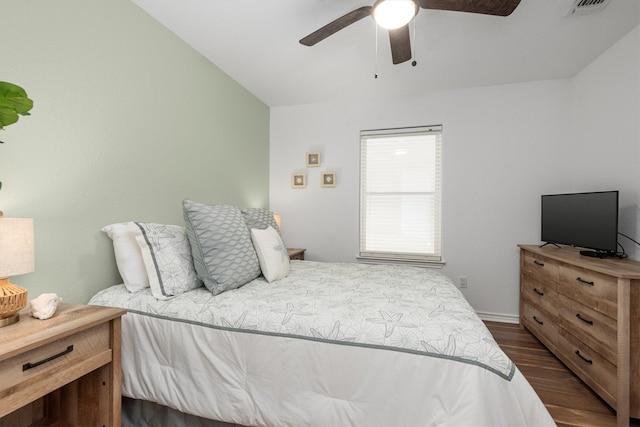 bedroom featuring dark wood-style floors and ceiling fan