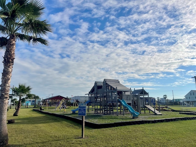 community jungle gym with a yard