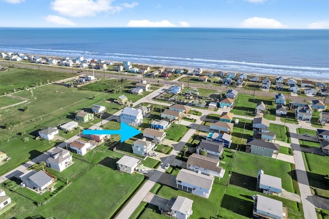 drone / aerial view featuring a residential view and a water view