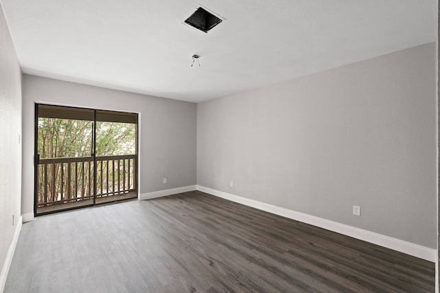 empty room with hardwood / wood-style flooring