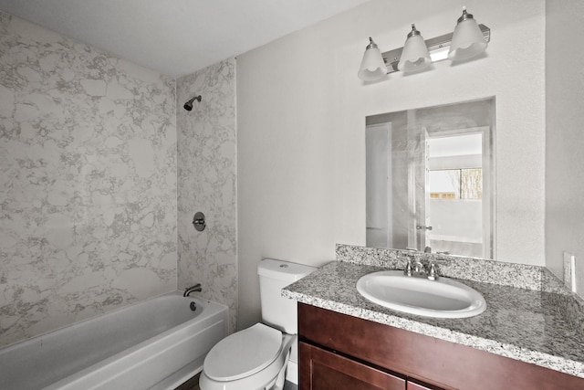 full bathroom with toilet, tiled shower / bath combo, and vanity