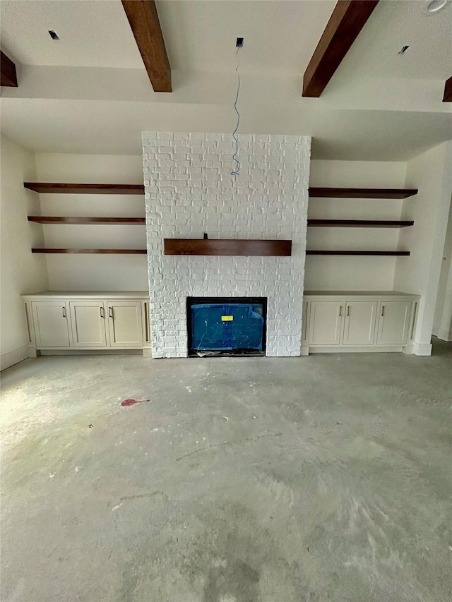 unfurnished living room featuring beam ceiling and a fireplace