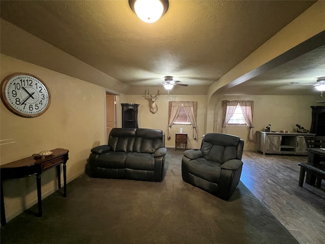 living room featuring ceiling fan and hardwood / wood-style floors