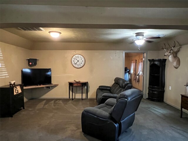 living room featuring ceiling fan and carpet