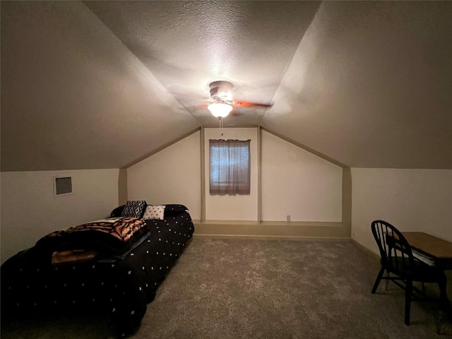 bonus room with ceiling fan, carpet, a textured ceiling, and lofted ceiling