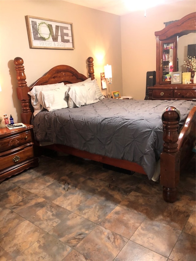 bedroom featuring dark tile patterned floors