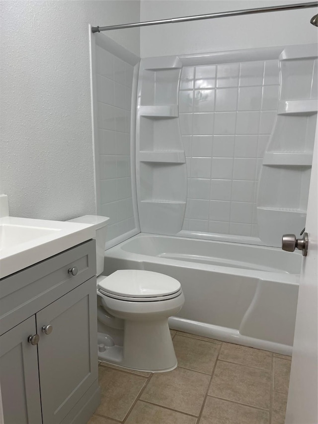 full bathroom featuring tile patterned flooring, vanity, tub / shower combination, and toilet