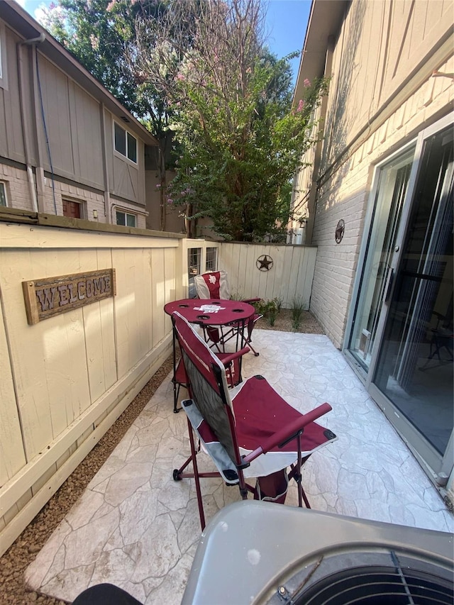 view of patio / terrace featuring fence