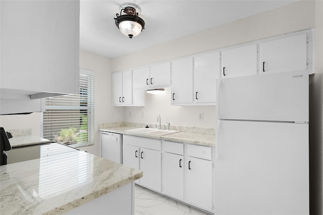 kitchen featuring white appliances, light stone counters, marble finish floor, white cabinetry, and a sink