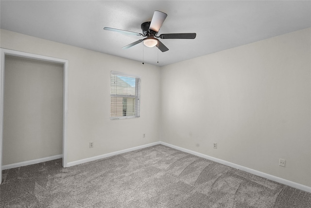 unfurnished bedroom featuring ceiling fan, carpet, and baseboards