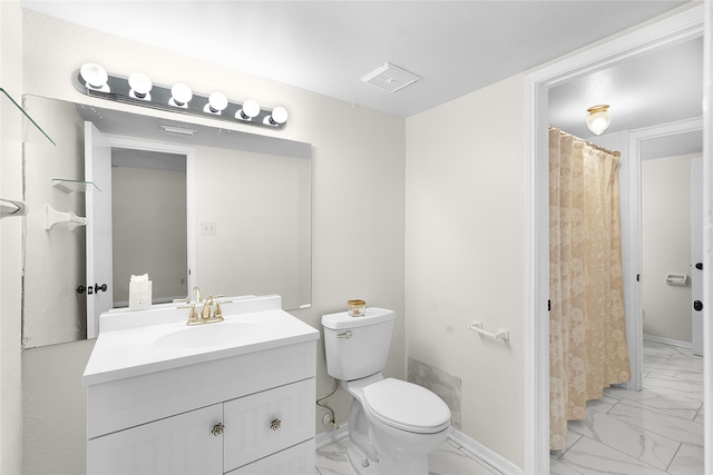 bathroom with tile patterned flooring, toilet, and vanity