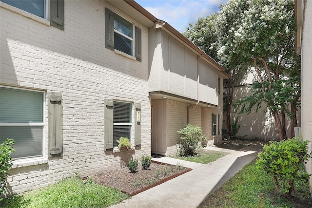 view of home's exterior with brick siding