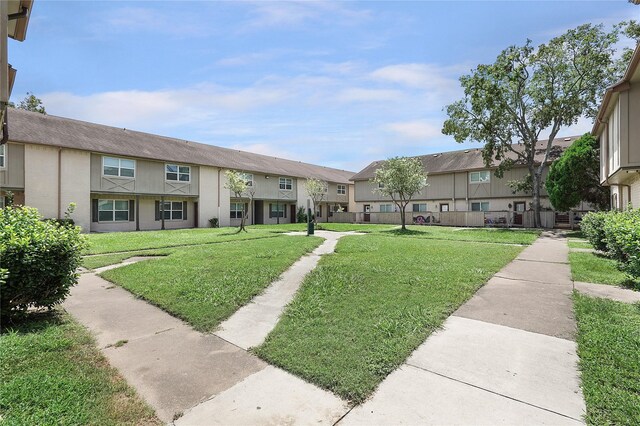 view of community with a lawn