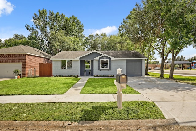 ranch-style home featuring a front yard and a garage