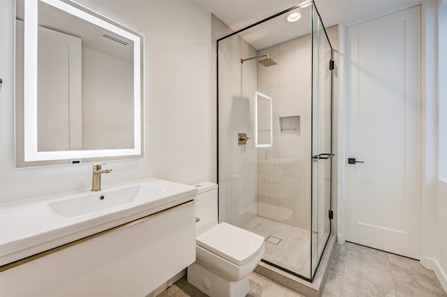 bathroom featuring walk in shower, tile patterned flooring, vanity, and toilet