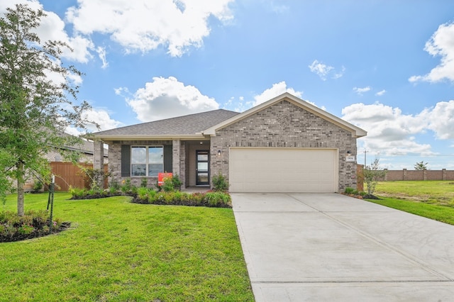 view of front of house featuring a garage and a front lawn