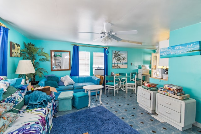 living room featuring tile patterned flooring and ceiling fan