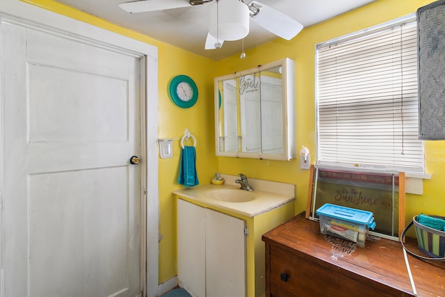 bathroom with ceiling fan, plenty of natural light, and vanity