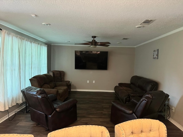 living room with dark hardwood / wood-style flooring, ornamental molding, a textured ceiling, and ceiling fan