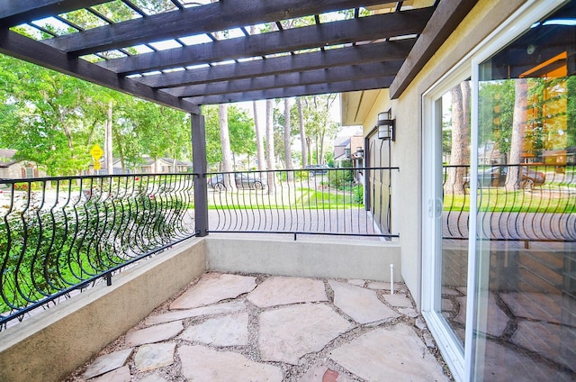 balcony featuring a pergola