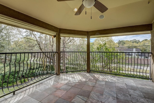 exterior space featuring ceiling fan