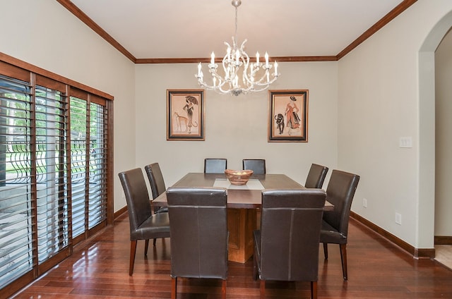 dining area featuring dark wood-type flooring, arched walkways, and baseboards