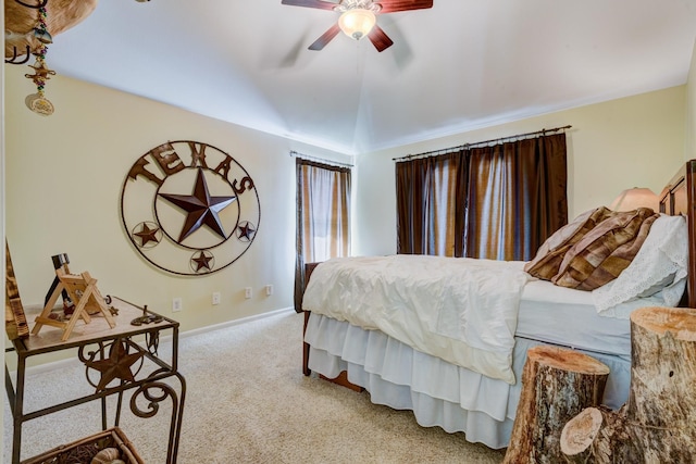 carpeted bedroom with ceiling fan and lofted ceiling