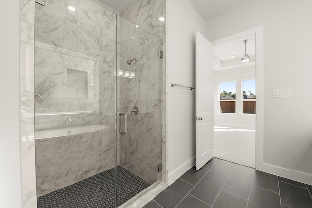 bathroom featuring tile patterned flooring and a shower with shower door