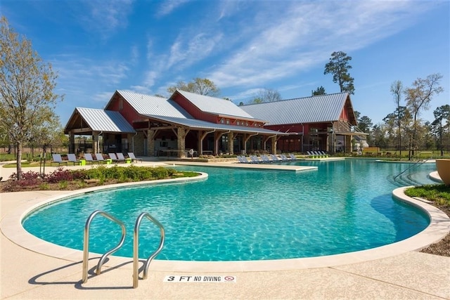 view of pool featuring a patio area