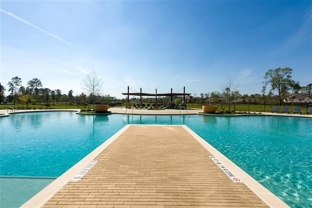 view of swimming pool with a patio area