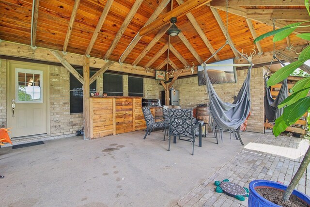 view of patio featuring electric panel and an outdoor structure