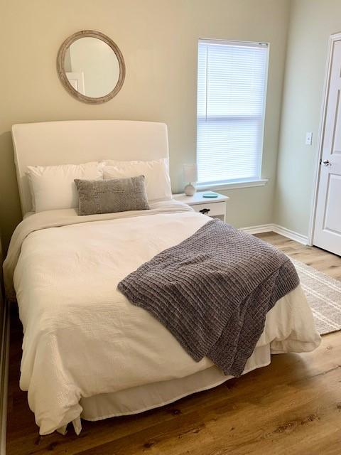 bedroom with wood-type flooring