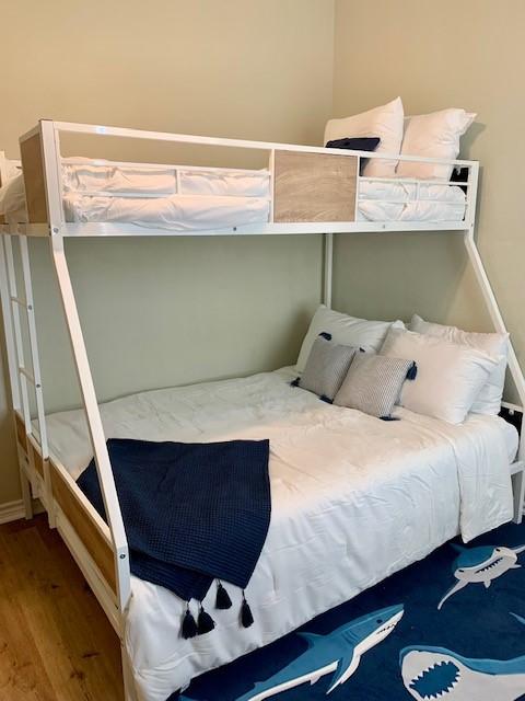 bedroom featuring wood-type flooring