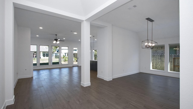 17711 Monarch Vista Ln, Conroe, TX 77302 - unfurnished living room featuring ceiling fan, dark wood-style flooring, a chandelier, and recessed lighting