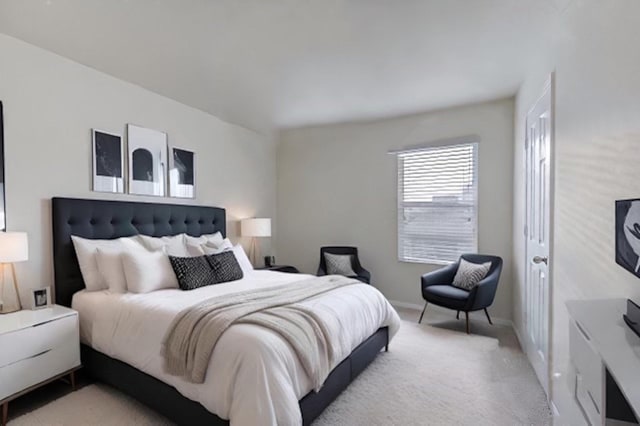 bedroom featuring light carpet