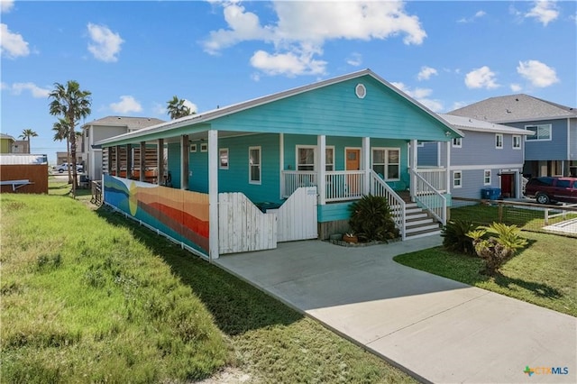 view of front of home with a front lawn and a porch