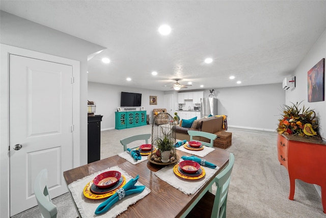 carpeted dining space with ceiling fan and a wall mounted AC