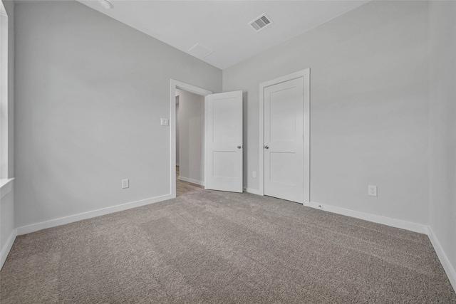 unfurnished bedroom with carpet floors