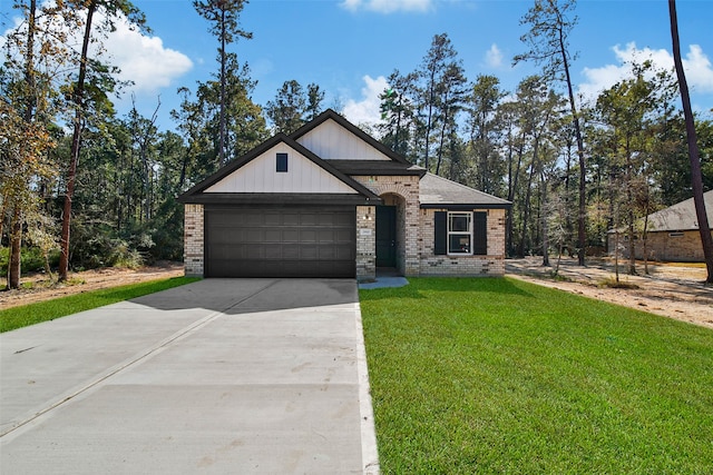 view of front facade with a front yard and a garage